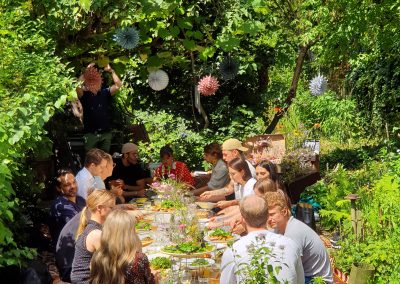 Guests at the garden to table restaurant with permaculture garden Cafe Botanico Berlin